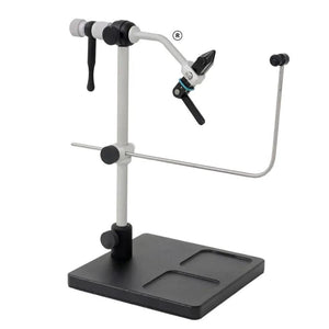 Renzetti Traveler 2200 rotary fly tying vise on black pedestal base with material clip and bobbin cradle