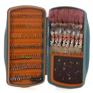 Fishpond Tacky Pescador MagPad fly box open, full of flies in orange silicone slits and a magnetic pad