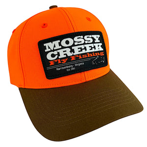 Mossy Creek Fly Fishing patch trucker hat with blaze orange front with a buck brown bill and black Est. logo patch